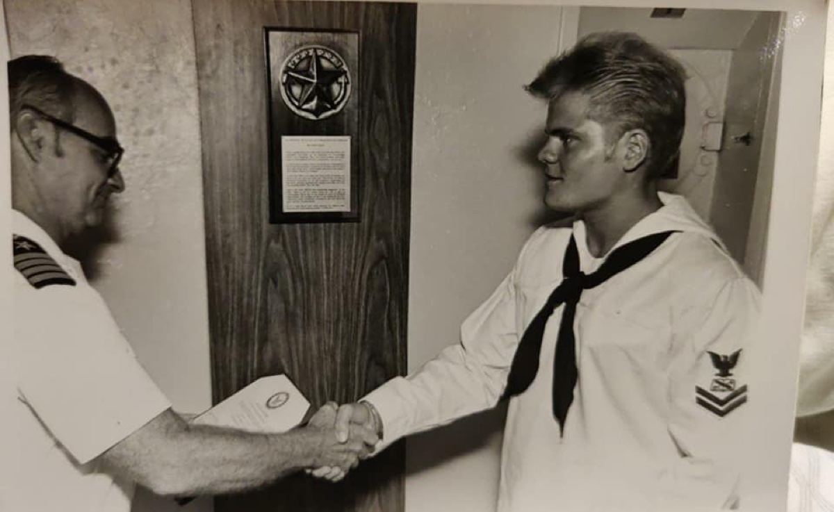 Christopher receiving commendation from XO of USS Albany CG-10